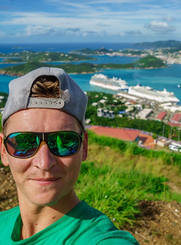 Man wearing sunglasses cap hi-res